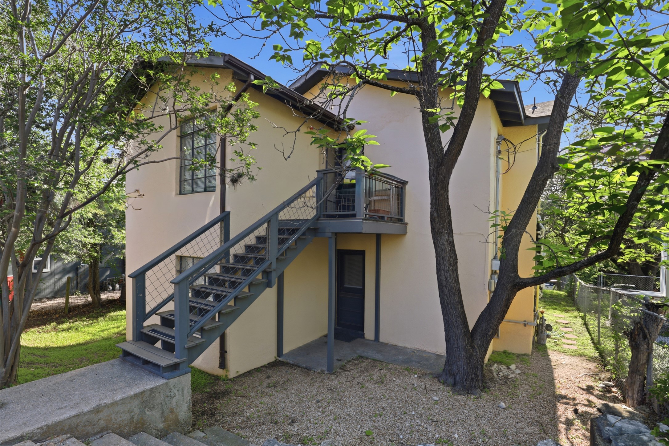 3901 Wrightwood Road, Unit A Austin, TX 78722 - Photo 11 of 11 Back of property with backdoor entry from assigned parking spot.