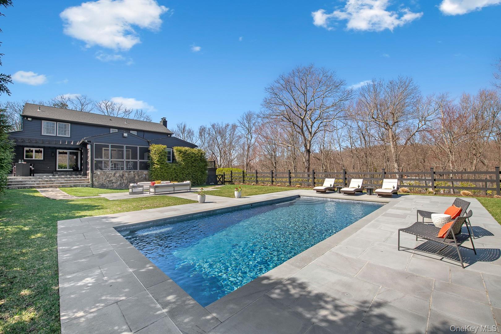 Undisclosed Address Pound Ridge, NY 10576 - Photo 30 of 35 Back of Home with View of Pool