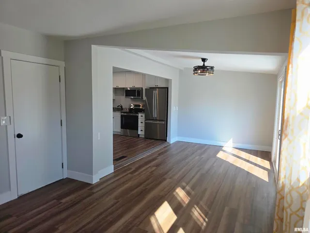 a view of gallery with wooden floor