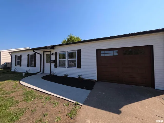 a front view of a house with yard