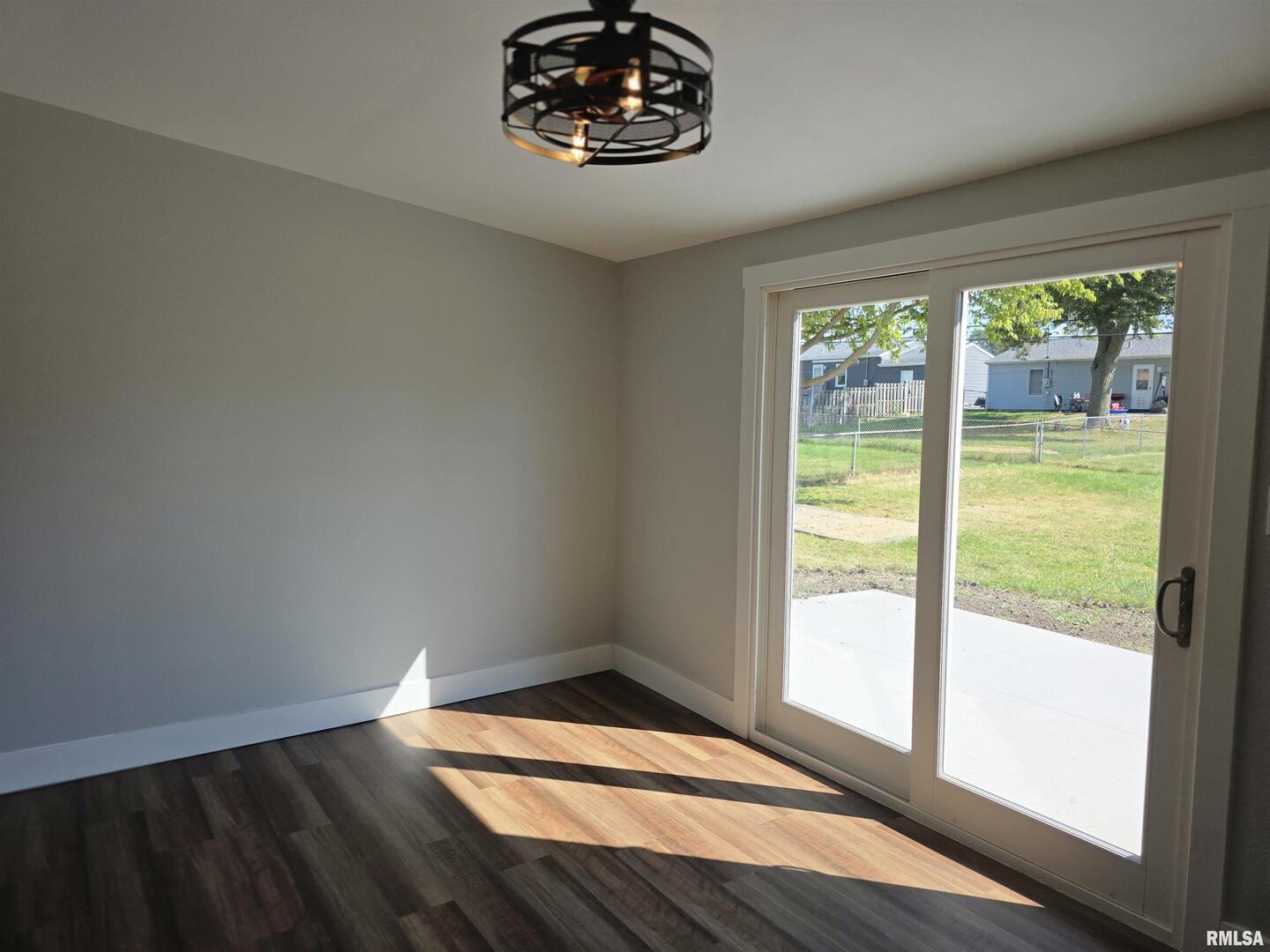 1031 Galbraith Drive Clinton, IA 52732 - Photo 23 of 35 a view of an empty room with wooden floor and a window