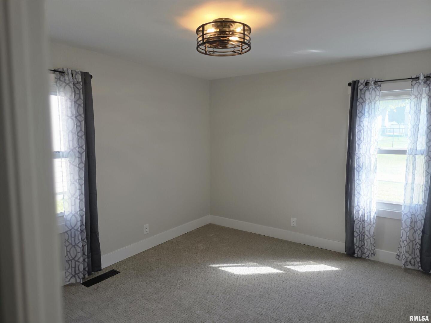 1031 Galbraith Drive Clinton, IA 52732 - Photo 29 of 35 an empty room with a window