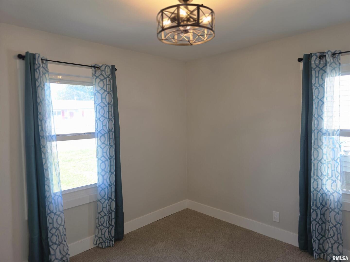 1031 Galbraith Drive Clinton, IA 52732 - Photo 31 of 35 an empty room with a window