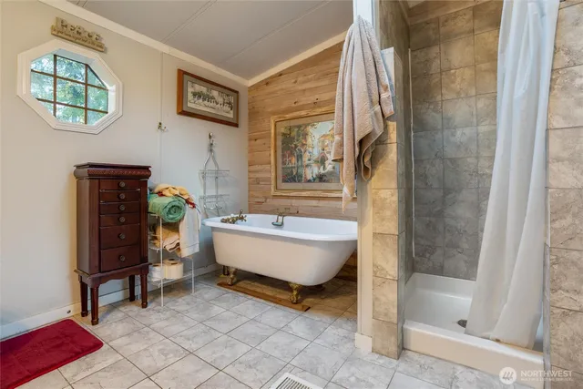 a bathroom with a bathtub and a shower