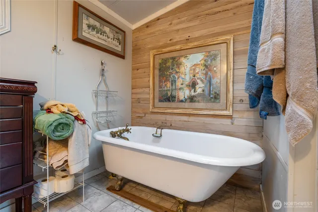 a bath tub sitting next to a window