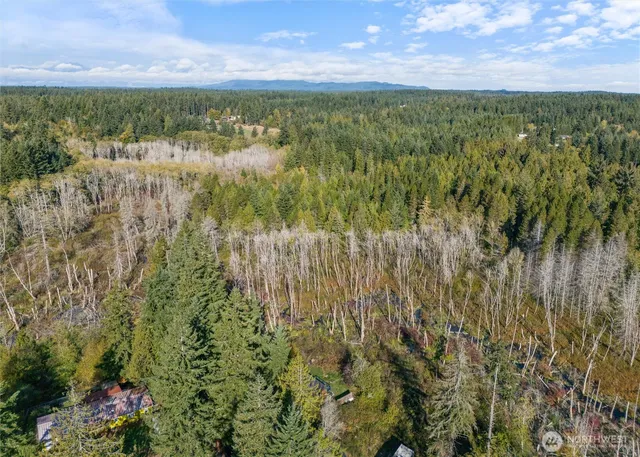 a view of a lake with a house in the background