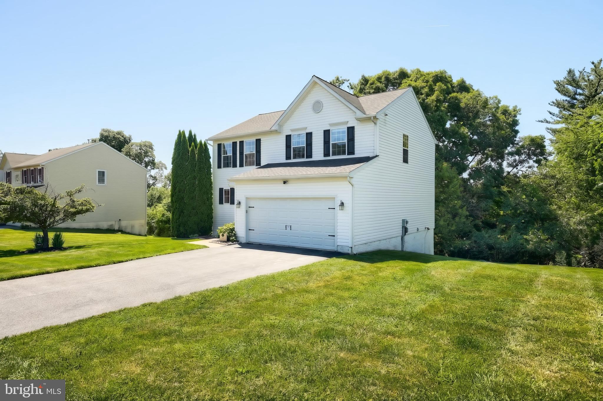 425 Lakeview Drive Spring Grove, PA 17362 - Photo 2 of 51 a front view of a house with a yard and garage