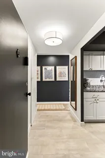 a view of an entryway with kitchen