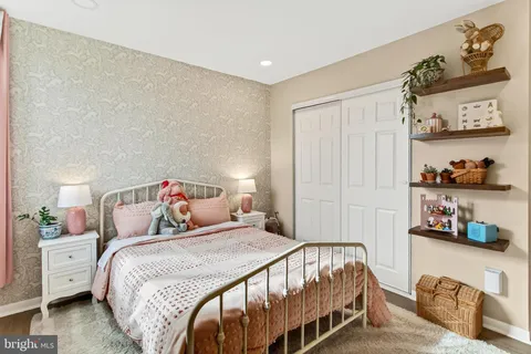 a bedroom with a bed and closet