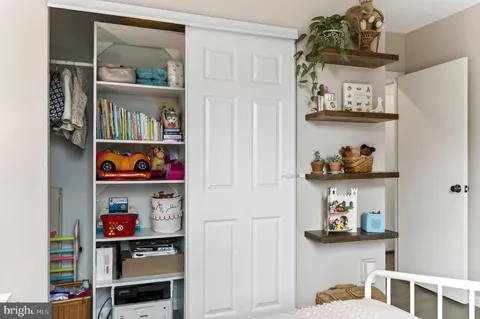 a room with a book shelf and a book shelf