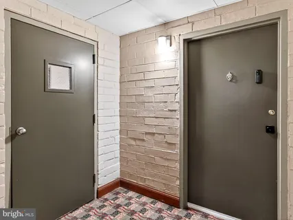 a bathroom with a shower and a sink