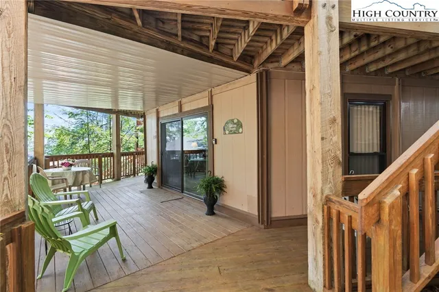 a view of an chairs and table in the balcony