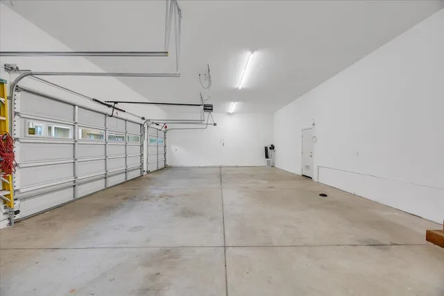 a front view of a building with a garden