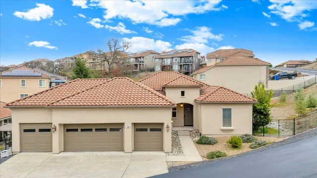 a room with pool table and paintings on the wall