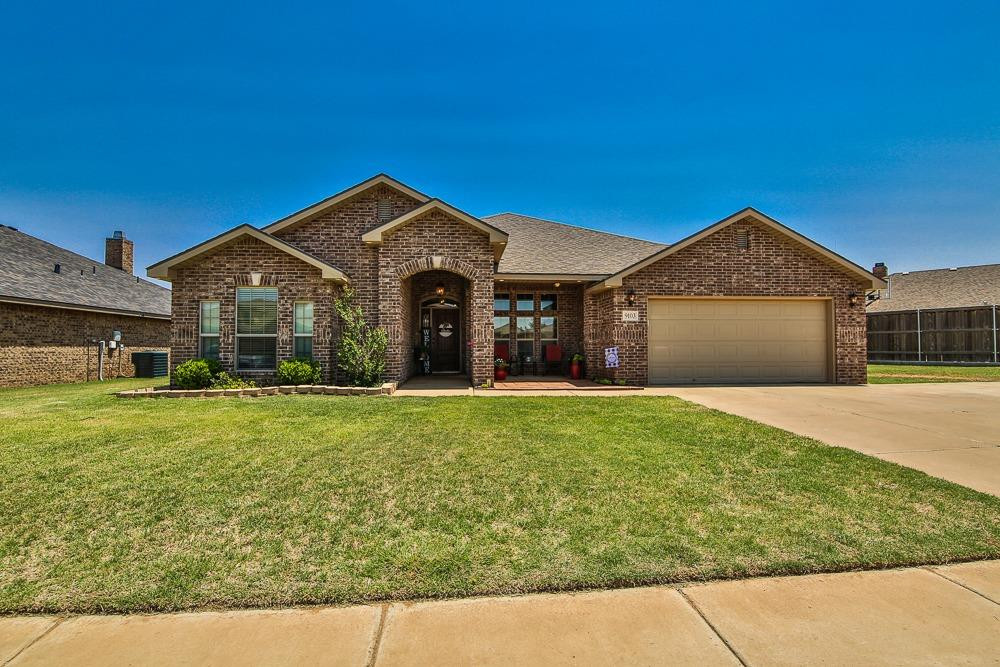 9103 Rochester Avenue Lubbock, TX 79424 - Photo 1 of 26 a front view of a house with garden