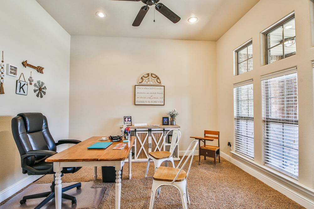 9103 Rochester Avenue Lubbock, TX 79424 - Photo 14 of 26 a view of a dining room with furniture and a window