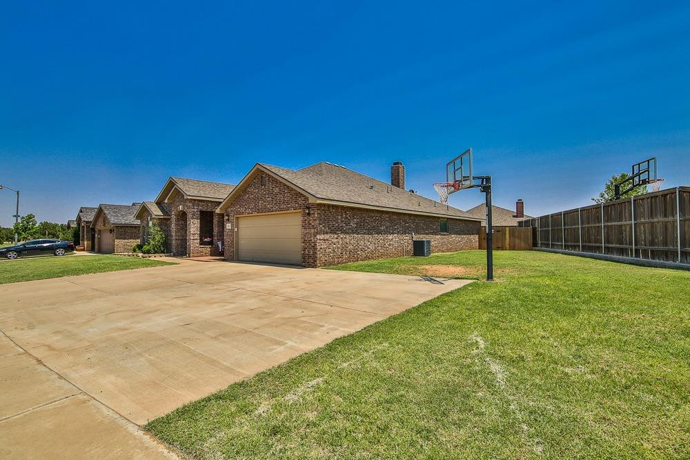 9103 Rochester Avenue Lubbock, TX 79424 - Photo 4 of 26 a house view with a backyard space