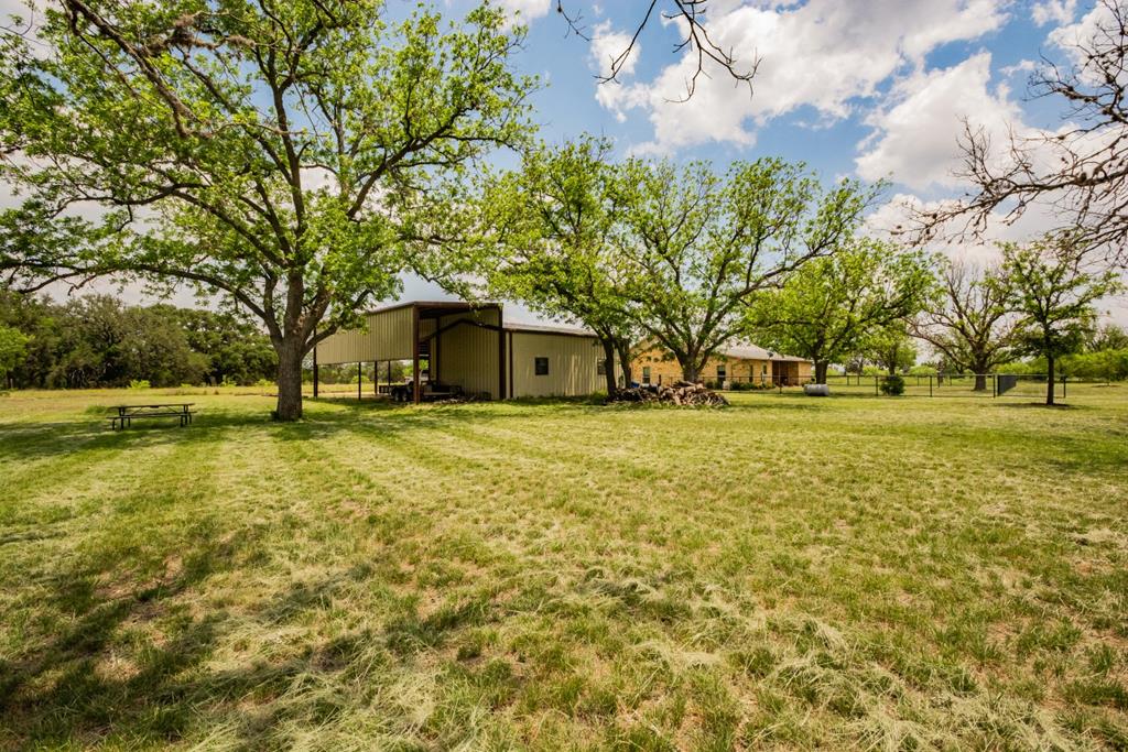 2657 West Sabinal Road Utopia, TX 78884 - Photo 11 of 36 a front view of house with yard and trees