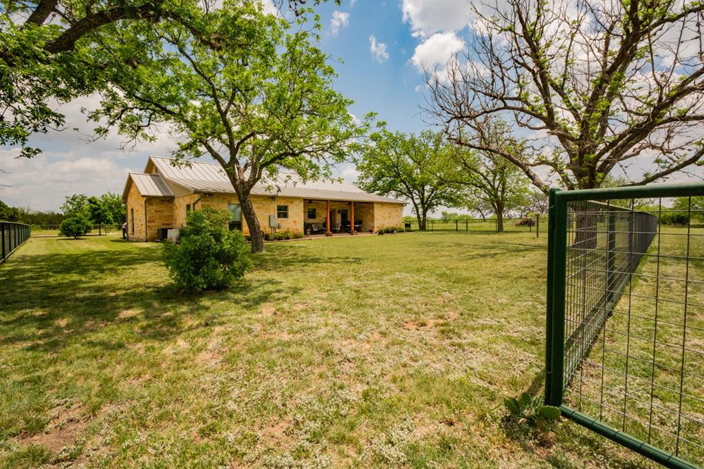 2657 West Sabinal Road Utopia, TX 78884 - Photo 15 of 36 a view of a yard with plants and large tree