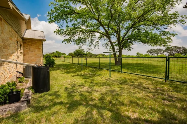 a view of a dinning tables and chairs in patio of the house