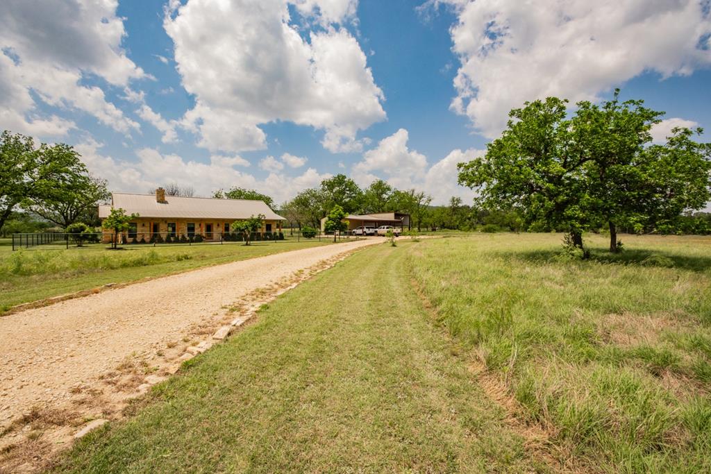2657 West Sabinal Road Utopia, TX 78884 - Photo 24 of 36 a view of an swimming pool and a yard