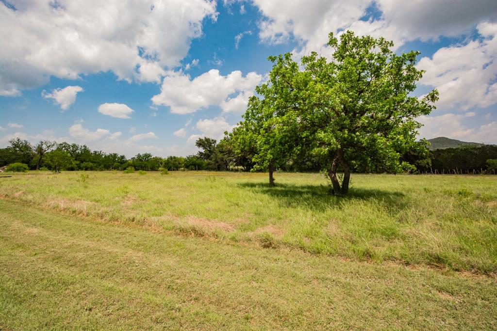 2657 West Sabinal Road Utopia, TX 78884 - Photo 25 of 36 a view of a lake with a yard