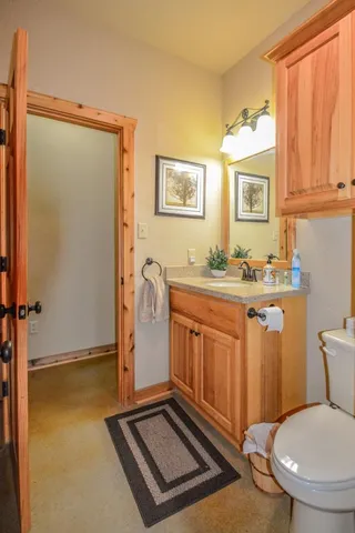a kitchen with a window a sink and cabinets