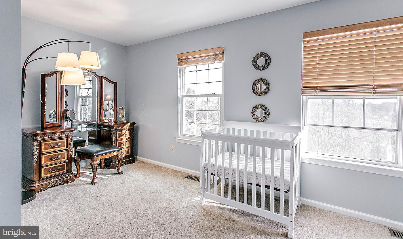 278 Ripka Street Philadelphia, PA 19127 - Photo 15 of 30 a view of a bedroom with furniture and windows