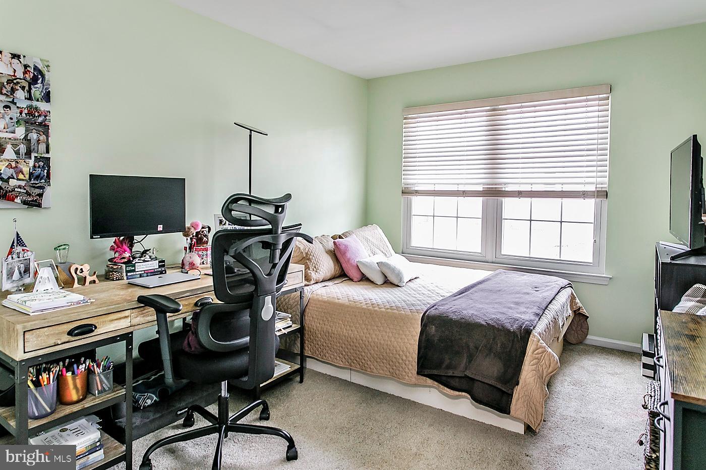 278 Ripka Street Philadelphia, PA 19127 - Photo 19 of 30 a bedroom with a bed a flat screen tv and a window
