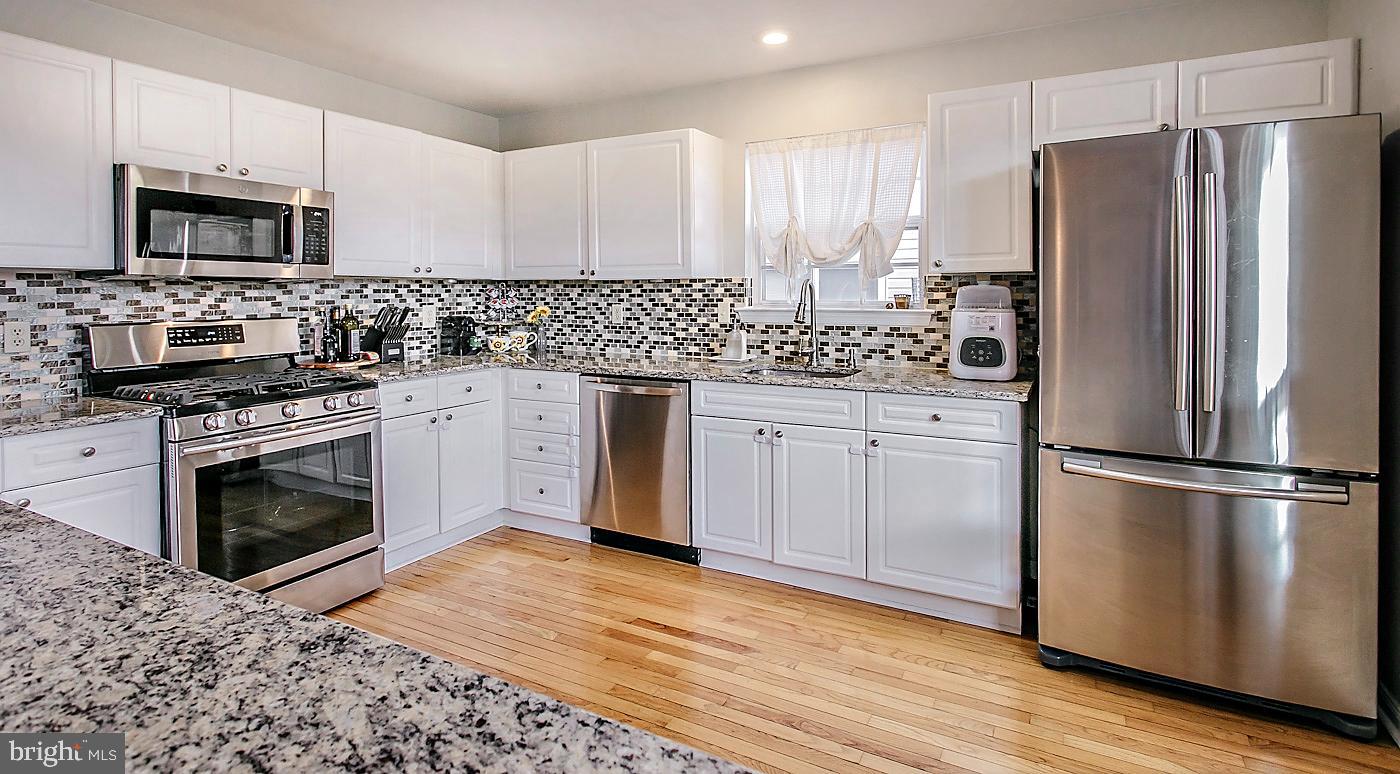 278 Ripka Street Philadelphia, PA 19127 - Photo 9 of 30 a kitchen with a sink stove and refrigerator