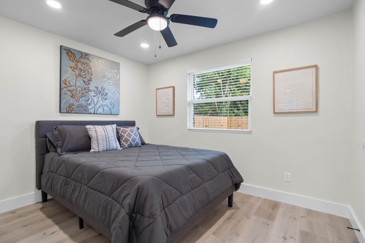 3138 Sunbeam Street Houston, TX 77051 - Photo 33 of 50 Bright, airy, and beautifully staged, this inviting bedroom offers comfort, style, and versatile living space.
