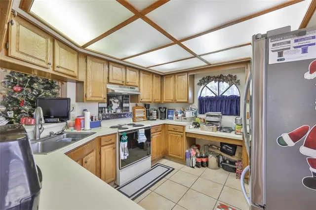 a kitchen that has a lot of cabinets in it and a window