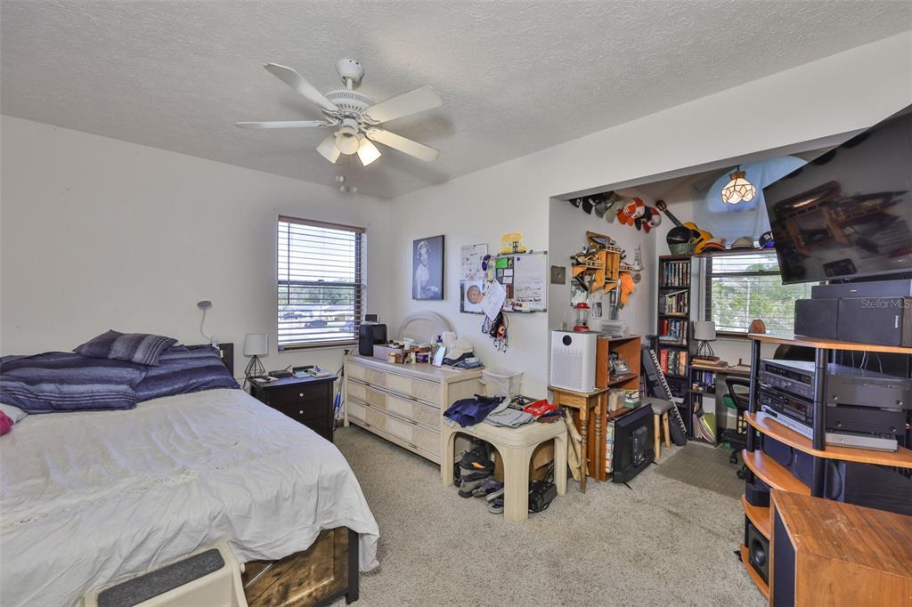 411 12th Street Southwest Ruskin, FL 33570 - Photo 22 of 33 a bedroom with furniture and a window