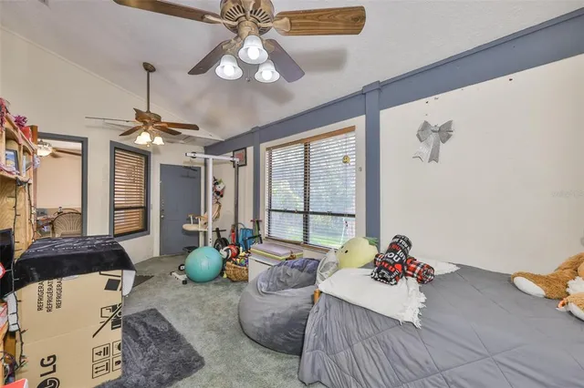a living room with furniture and chandelier