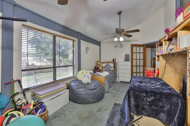 a living room filled with furniture and a chandelier