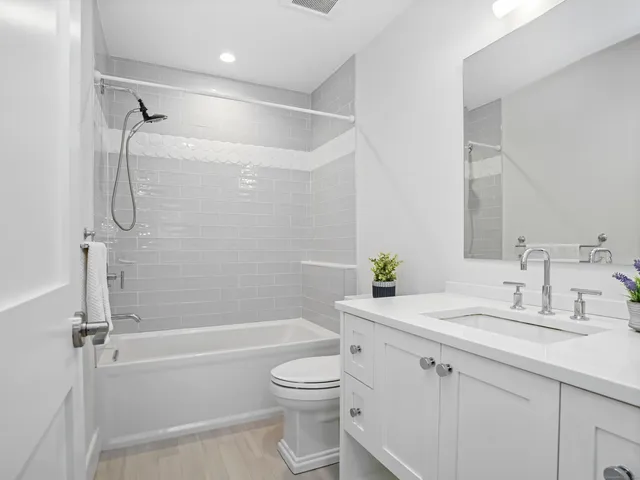 a bathroom with a sink a toilet and a bathtub