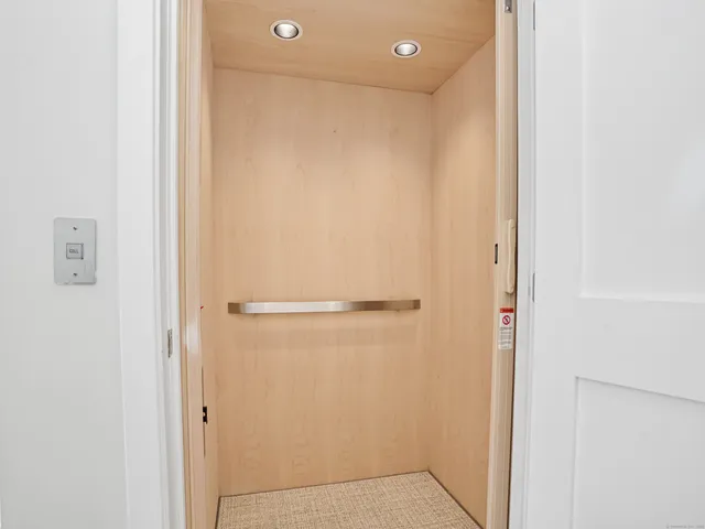 a bathroom with a shower and a glass door
