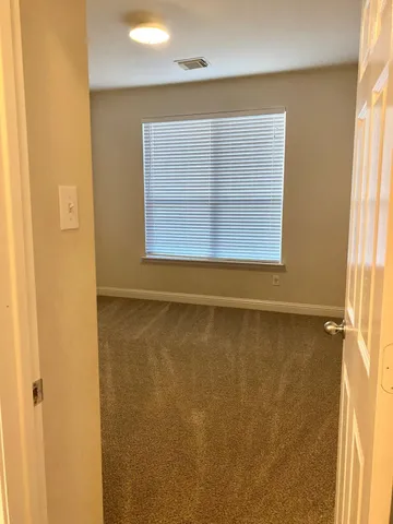 a view of a room that has a window in it