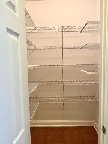 a view of a room with racks on the wall