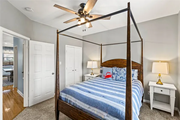 a bedroom with bed and a chandelier
