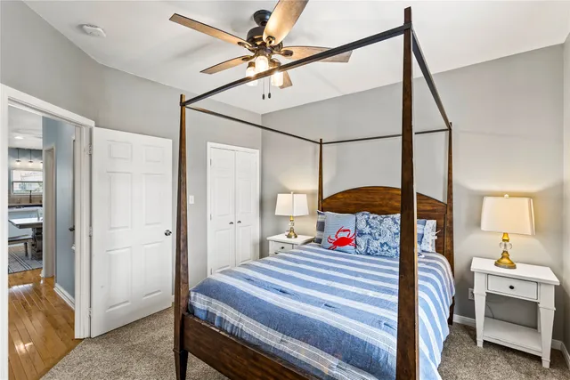 a bedroom with bed and a chandelier