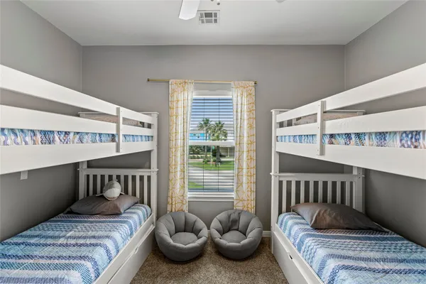 a bedroom with furniture and a window