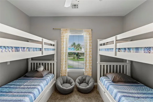 a bedroom with furniture and a window