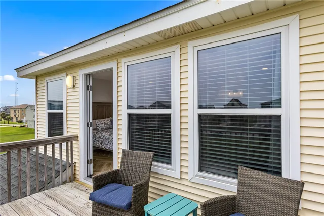 a view of a balcony with furniture