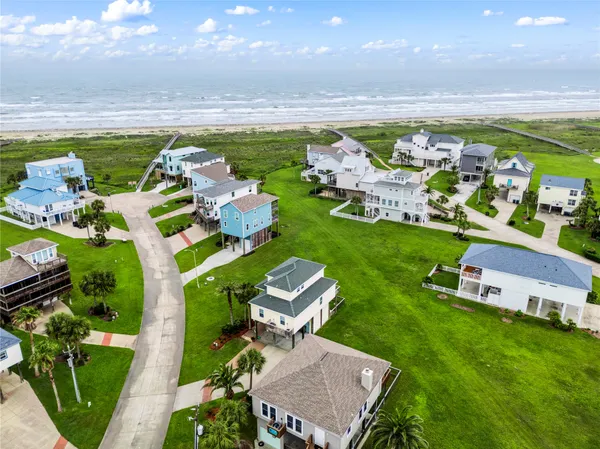 an aerial view of a house with outdoor space swimming pool