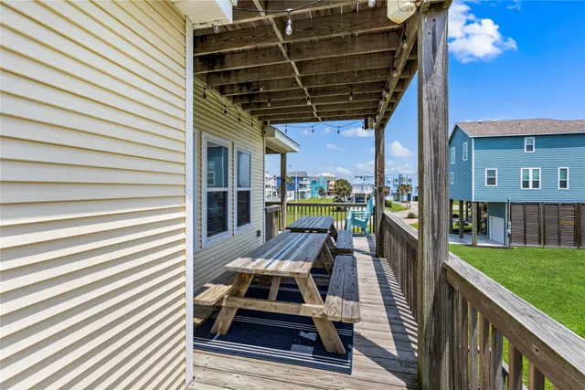 a view of a porch with furniture and yard