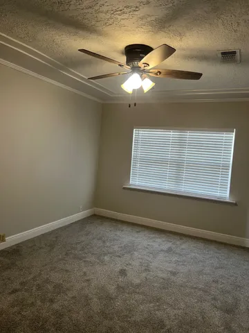 a kitchen with stainless steel appliances white cabinets and a stove