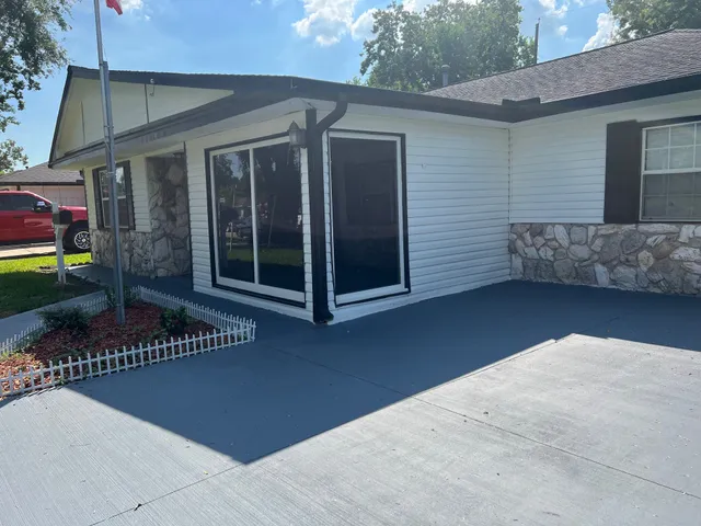 a view of a two chair in the patio of the house