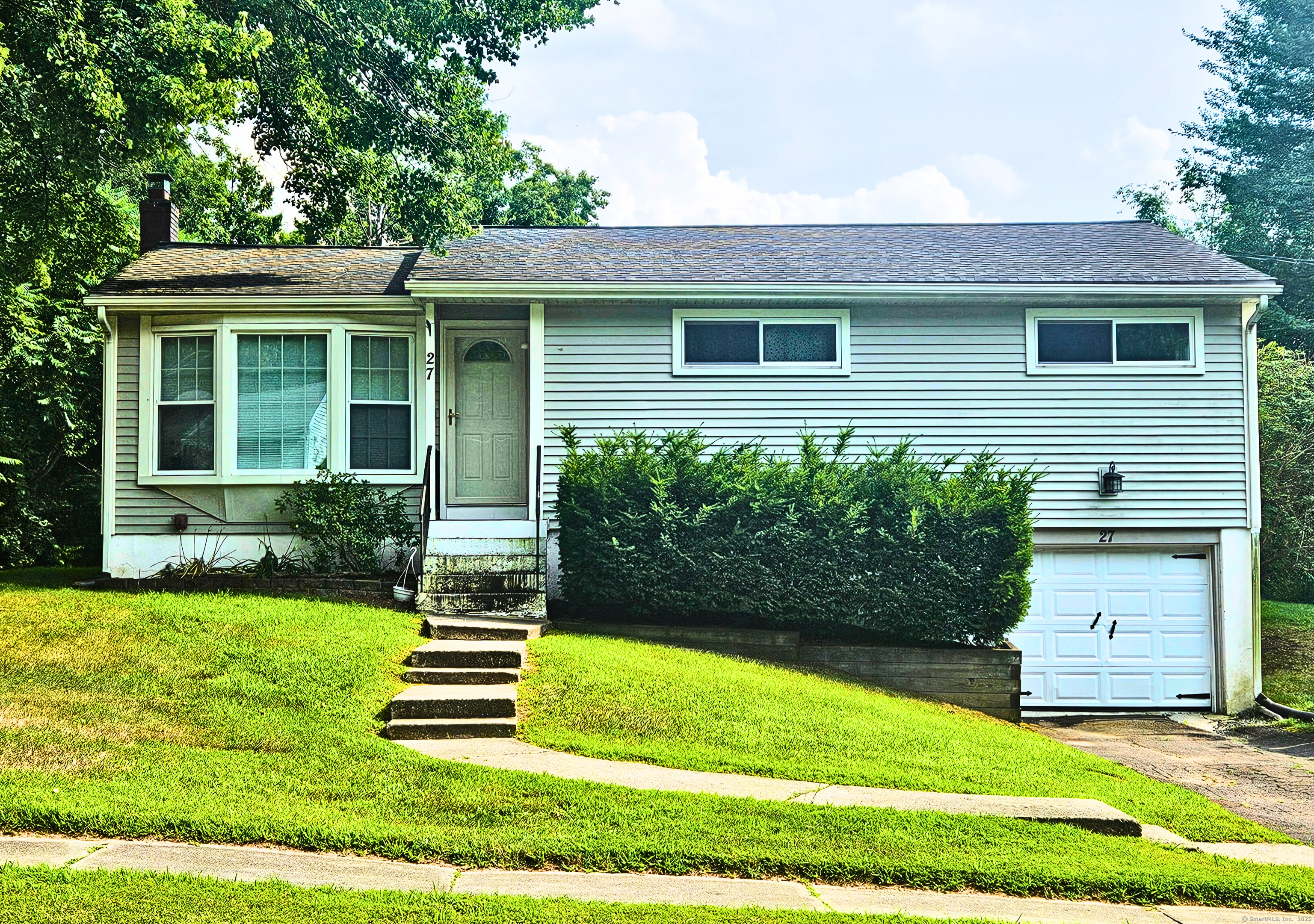 27 Highview Terrace Enfield, CT 06082 - Photo 1 of 1 a front view of a house with a yard