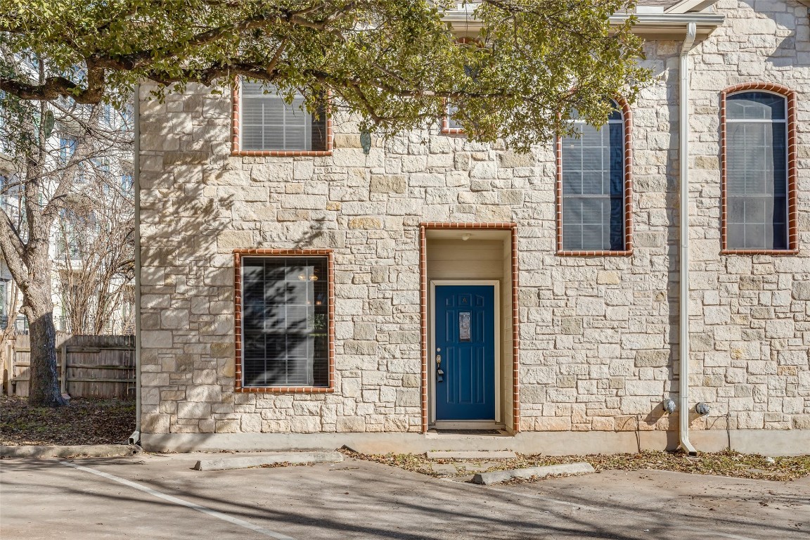 Beautiful limestone facade.  End unit with access to open green space.